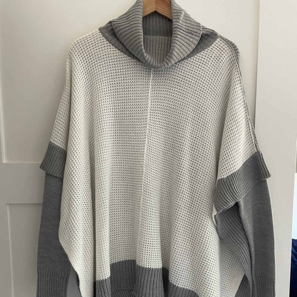 Francesca’s gray and white knit poncho